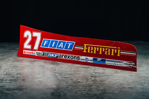 Formula 1 side wing, Ferrari 126CK, historic F1 collectible, featuring sponsor decals. / Ala laterale di Formula 1, Ferrari 126CK, oggetto da collezione con adesivi sponsor.